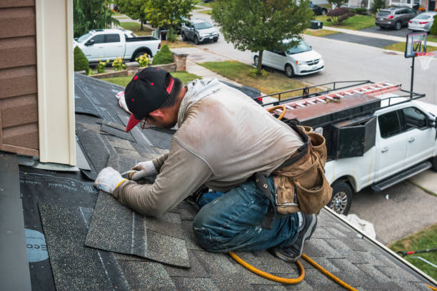 Professional Roofing technician working in Donald, OR
